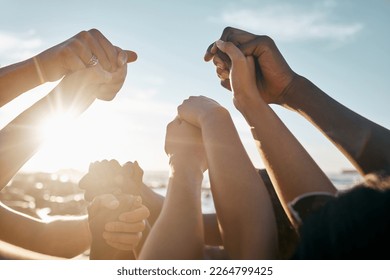Friends, bonding and holding hands on beach social gathering, community trust support or summer holiday success. Men, women and diversity people in solidarity, team building or travel mission goals