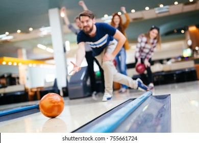 Friends Bowling At Club