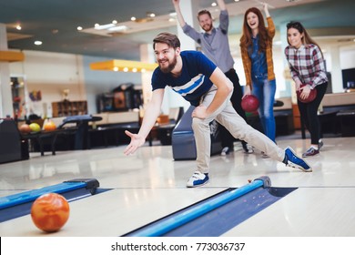 Friends Bowling At Club