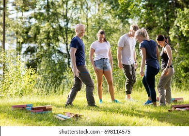 Friends With Building Blocks On Grassy Field In Forest - Powered by Shutterstock