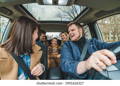 Friends In Car With Little Kid. Car Travel Concept. Adventure Time