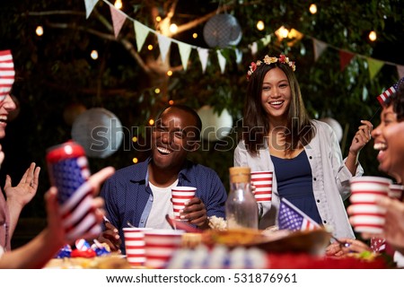 Friends Celebrating 4th Of July Holiday With Backyard Party