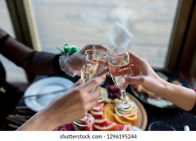 Friends Celebrating Bachelorette Party With Glass Of Champagne