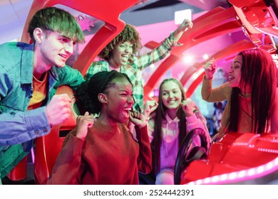 Friends Cheering and Celebrating at Arcade Racing Game, group of friends excitedly cheer and celebrate a victory while playing an arcade racing game, enjoying the thrill together. - Powered by Shutterstock