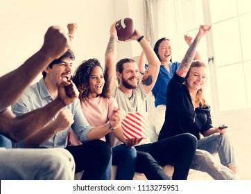 Friends cheering sport league together - Powered by Shutterstock