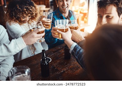 Friends, cheers and restaurant with fun celebration and reunion with beer at a pub or bar with happy people. Group, glasses and smile with drinks toast for event or birthday together with laugh - Powered by Shutterstock