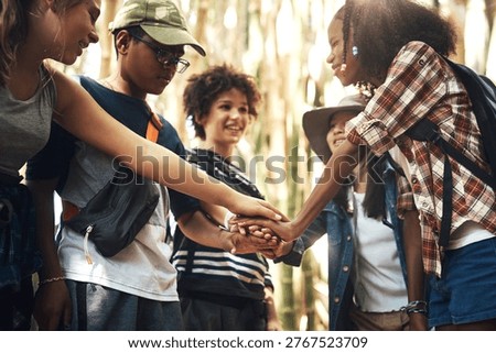 Friends, children and stack with hands at summer camp with smile in forest, motivation and goals. Kids, group and happy for support with pile, connection and synergy at adventure park in woods