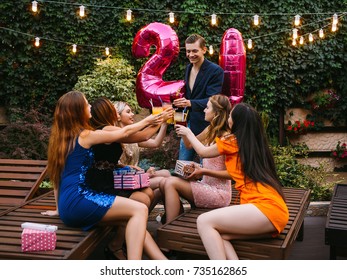 Friends Company At Birthday 21st Party. Happy Celebration In Atmospheric Place Outdoors, Adulthood For Male. Joyful Toast With Beverages, Congratulation Concept