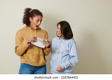 Friends Congratulating Girl Receiving Acceptance Letter From College