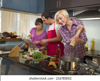 Friends Cooking In The Kitchen.