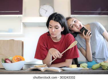 Friends Cooking In The Kitchen