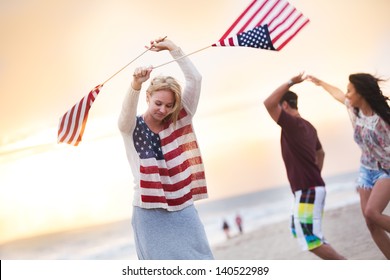 Friends Dancing on the Beach in California at sunset - Powered by Shutterstock