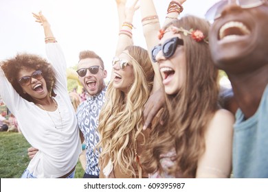 Friends Dancing At Outside Concert
