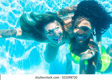 Friends Diving Underwater In Swimming Pool, Black And White Girl