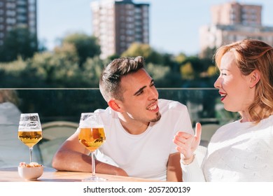 Friends Drinking Beer At Rooftop Bar Supporting Small Business. Genuine Friendship Lifestyle Concept With Men And Women Spending Happy Hour Together In Pub