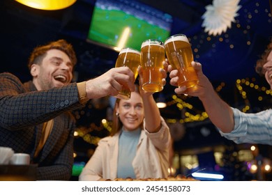 Friends drinking beer while rest in pub
