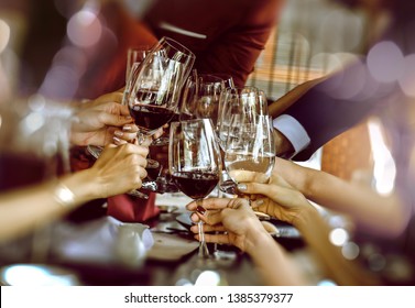 Friends Drinking Red Wine At The Party,