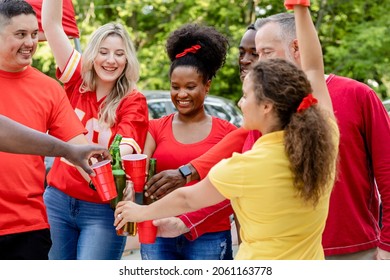 Friends Drinking At A Tailgate Party