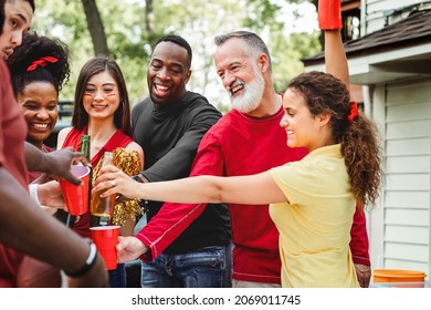 Friends Drinking At A Tailgate Party