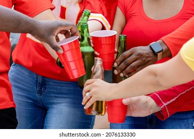 Friends Drinking At A Tailgate Party