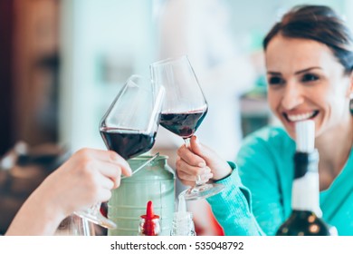 Friends Drinking Wine In Restaurant