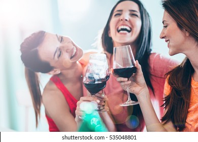 Friends Drinking Wine In Restaurant