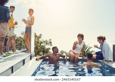 Friends, drinks and party in swimming pool with space for mock up with blue sky in summer with conversation. Men, women and people in group in water, relax and talking with alcohol at social event - Powered by Shutterstock