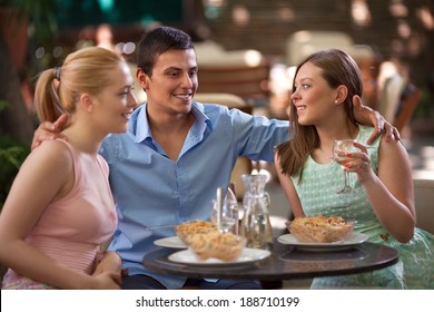 Friends Eating Dinner In A Italian Restaurant