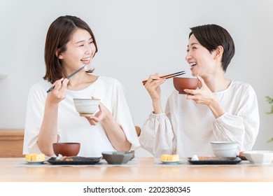 Friends eating together at home - Powered by Shutterstock