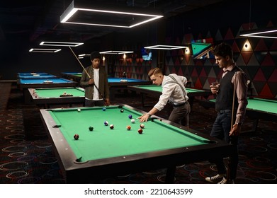 Friends Enjoying Billiard Game At Pool Hall