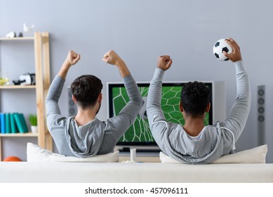 Friends Enjoying Soccer In TV