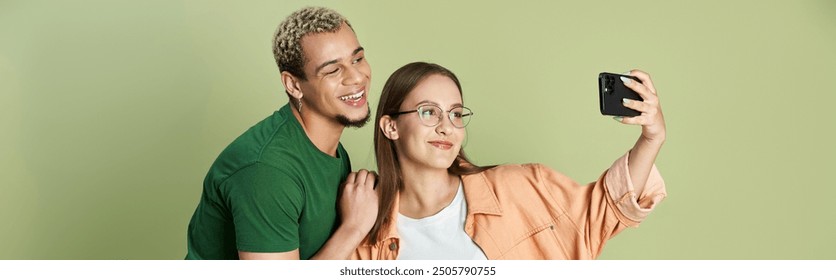 Friends enjoying time together and taking a selfie with smiles on their faces. - Powered by Shutterstock