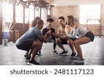 Friends, exercise and squat in group at gym for workout, core fitness or training together indoors. Diverse class, people and warm up for ab muscle, session or sport for health challenge in gymnasium