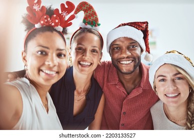 Friends, family and diversity in a Christmas selfie to celebrate the festive season. Black man, women and a happy smile at office xmas party. Team celebration and taking a holiday photo. - Powered by Shutterstock