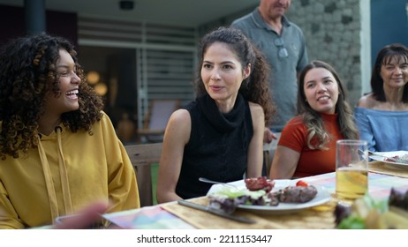 Friends And Family Gathered Together For Barbecue In Home Backyard Party. People Celebrating Life Toasting With Drinks