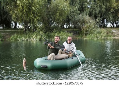 Friends fishing from boat on river. Recreational activity - Powered by Shutterstock