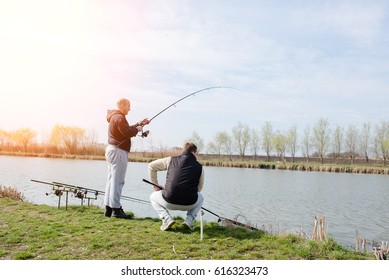 Friends Are Fishing On Lake