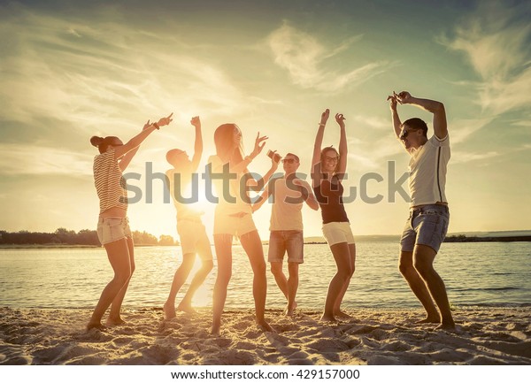 Friends Funny Dance On Beach Under Stock Photo (Edit Now) 429157000