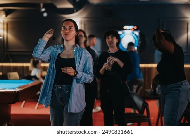 Friends gather for a playful night out, throwing darts and sharing laughter in a vibrant bar setting. - Powered by Shutterstock