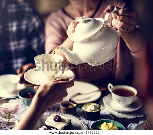 Friends Gathering Together On Tea Party Stock Photo (Edit Now) 676338244