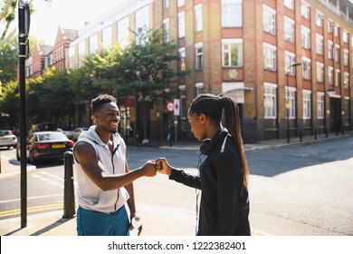 Friends Giving A Fist Bump In London