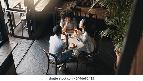 Friends, group and talking in coffee shop for communication catch up or university reunion, gossip or pastry, Man, woman and chat in cafe together as consumer for bonding lunch, diversity or social - Powered by Shutterstock