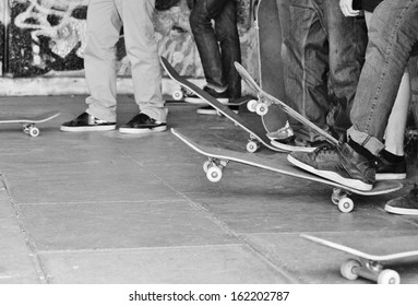 Skateboard skate board Friends Group Sneaker kids group Of Teenager In Jeans With Sneakers Trainers Skateboards And Graffiti With Copy Space Stock Photo, Stock, Photograph