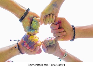 Friends Hands Close Up In Holi Paint. Copy Space