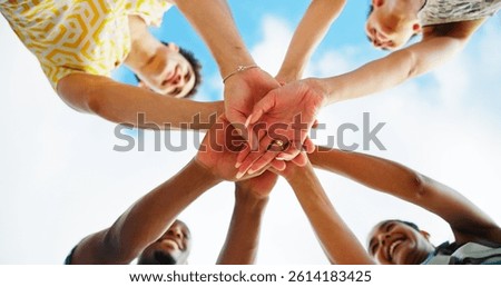 Friends, hands stack and low angle with sky, smile and support with motivation, diversity and cheers. People, group and happy with celebration, reunion and excited in nature, outdoor and vacation