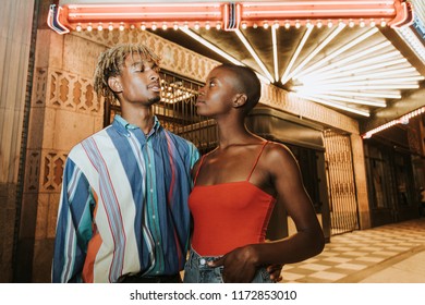 Friends hanging out outside a cinema - Powered by Shutterstock