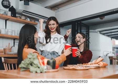 Friends hangout. Young female celebrating birthday party at weekend at home, eating pizza, drinking champagne, party, lifestyle, friendship