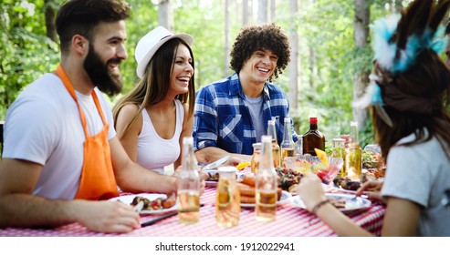 Friends Having A Barbecue Party In Nature