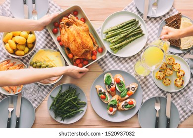 Friends Having Dinner At Table, Top View