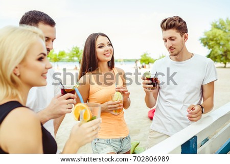 Group of young people laughing in summer party